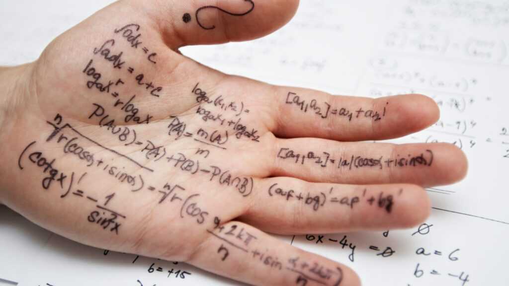 hand covered in formulas